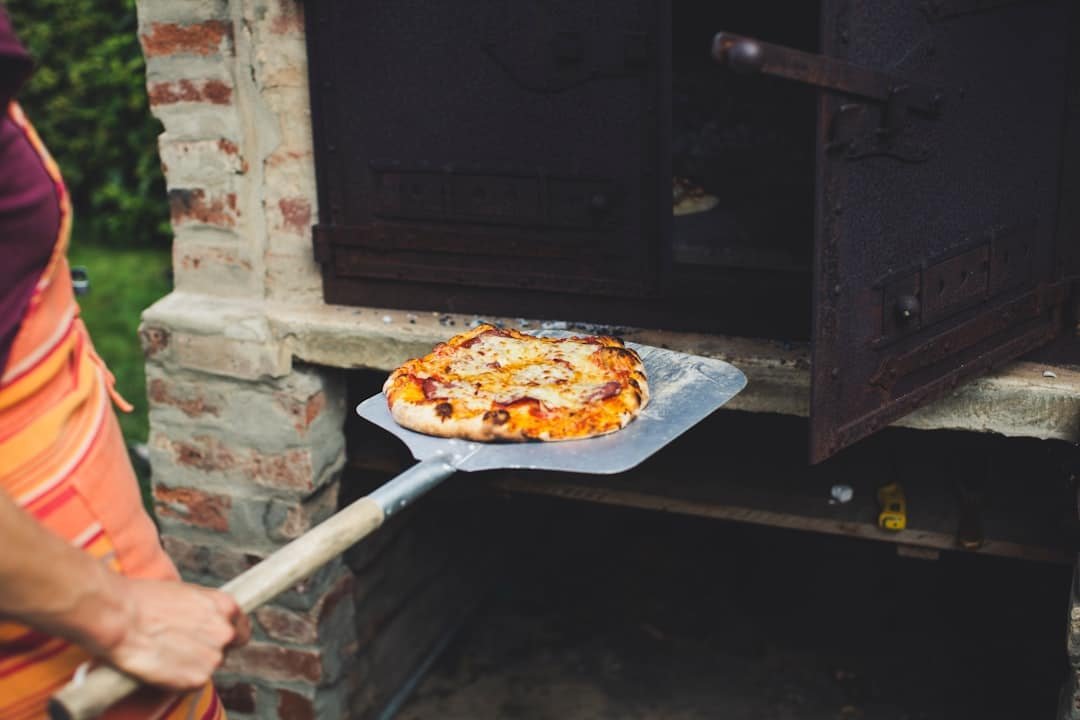 Photo Outdoor kitchen with pizza oven